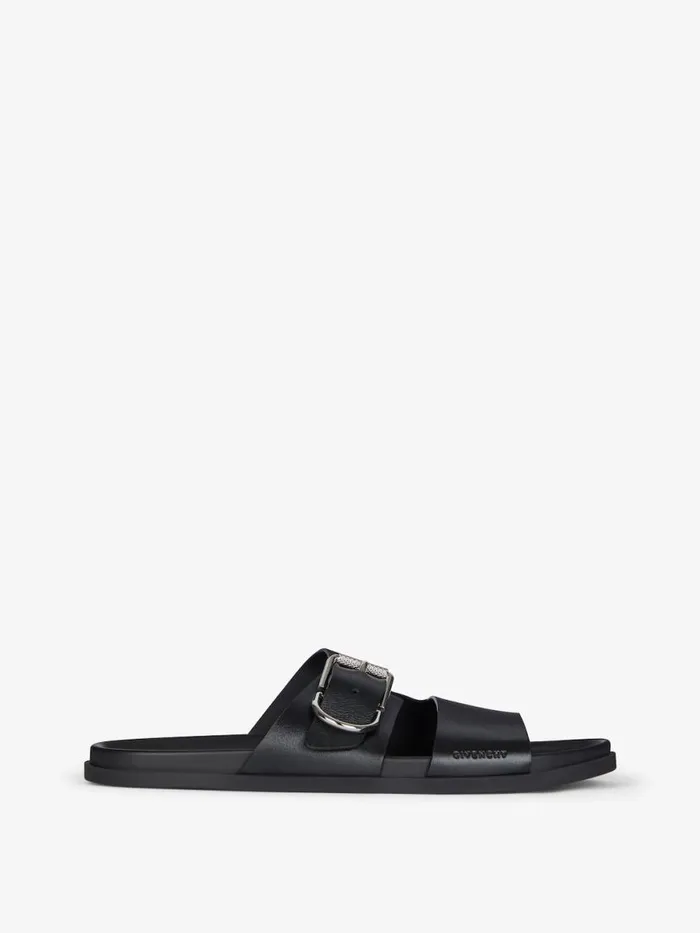 Men Slides and Sandals Givenchy Voyou Flat Sandals In Grained Leather Black